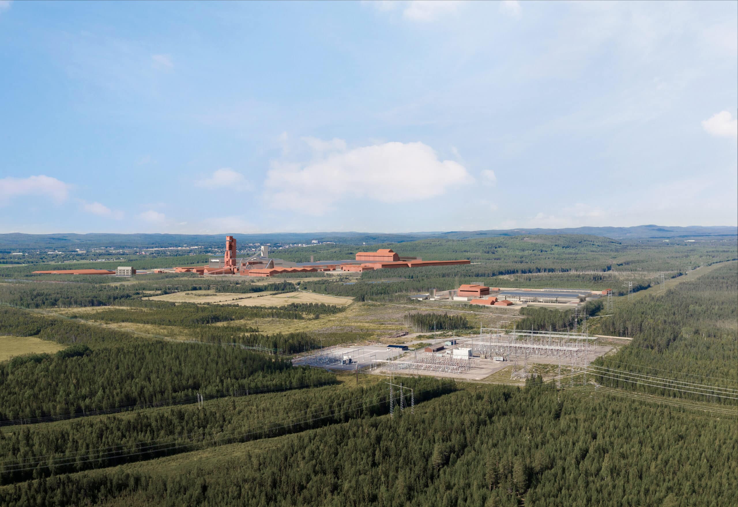 En bild av en stor industriell anläggning i en landsbygdsmiljö. Anläggningen består av flera stora byggnader med röda tak och ljusare väggar, och en hög skorsten som dominerar landskapet. I förgrunden syns en tät barrskog och anläggningen är omgiven av gröna fält. Bakom anläggningen öppnar sig en vidsträckt utsikt över böljande kullar och skogsmark under en klarblå himmel med några spridda moln. En kraftledningsgata med högspänningsledningar sträcker sig in i bilden från höger och leder in mot anläggningens transformatorstation