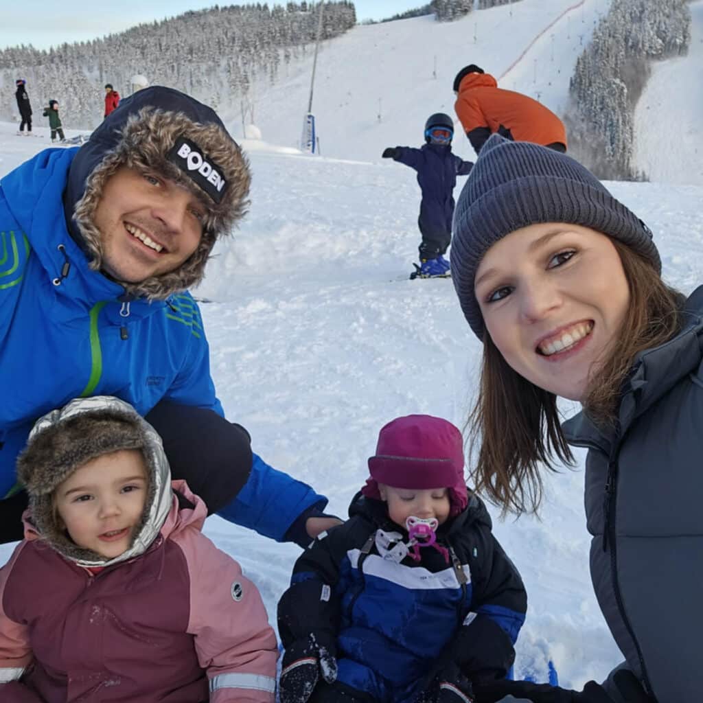 Family with two small children at ski slope